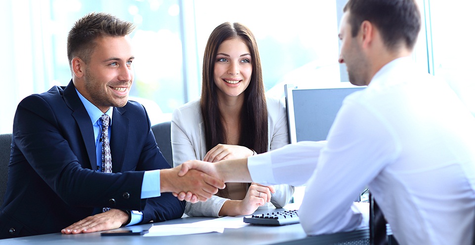 businessman shaking hands to seal a deal with his partner a